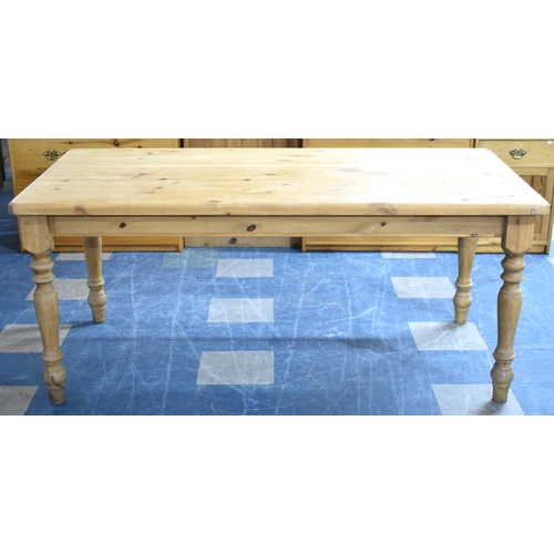 574 - A Mid/Late 20th Century Rectangular Pine Kitchen Table, 179cms by 91cms