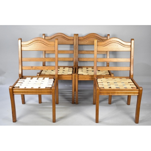 588 - A Set of Four Ladder Back Dining Chairs in Oak requiring New Pad Seats