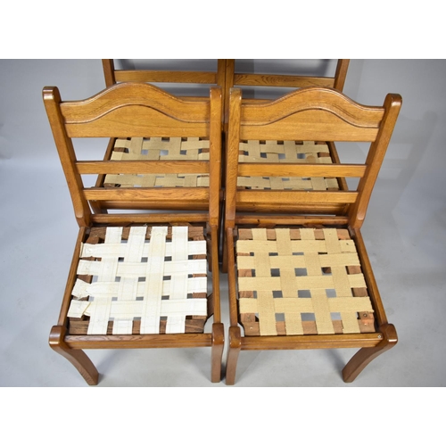 588 - A Set of Four Ladder Back Dining Chairs in Oak requiring New Pad Seats