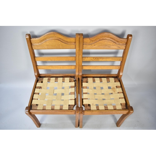 588 - A Set of Four Ladder Back Dining Chairs in Oak requiring New Pad Seats