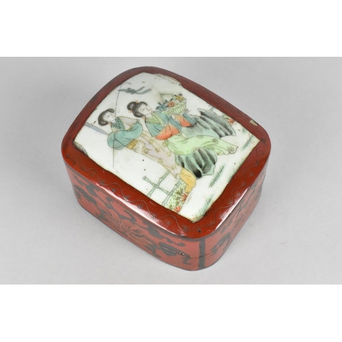 6 - A Chinese Lacquered Box, The Removable Lid with Mounted Porcelain Panel Decorated with Figures, 13cm... 