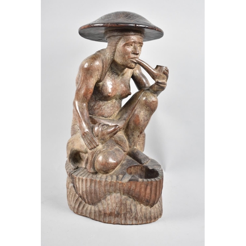 8 - A Carved Wooden Ashtray Depicting Seated Far Eastern Lady with Dog and Smoking Pipe, 37cms High