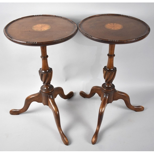 81 - A Pair of Reproduction Inlaid Mahogany Tripod Wine tables, 25.5cms Diameter and 43.5cms High