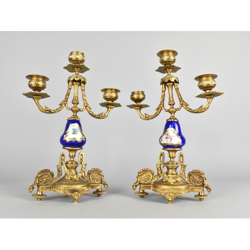 84 - A Pair of Reproduction French Style Ormolu and Ceramic Three Branch Candelabra Garnitures, 28.5cms H... 