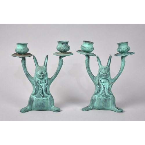 94 - A Pair of Green Patinated Spelter Two Branch Novelty Candlesticks in the Form of Anthropomorphic Rab... 