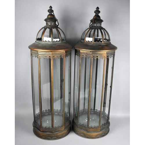 103 - A Pair of Very Tall Patinated Brass and Glass Lanterns on Circular Bases, 86cs High