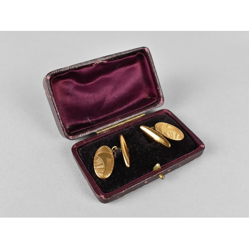 440 - A Pair of Gold Coloured Metal Cufflinks, Oval Plaque with Engraved Decoration, 4.1gms, in Fitted Ant... 