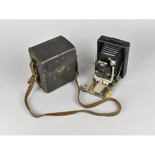 101 - A Vintage Folding Camera with Leather Cased Plate and Negatives