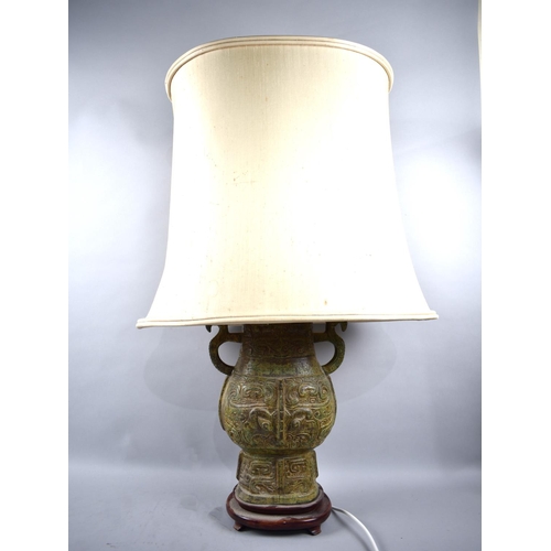 102 - A Large Oriental Style Ceramic Table Lamp in the Form of an Archaic Two Handled Vase, Complete with ... 