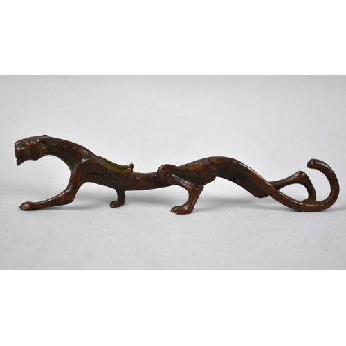 123 - A Patinated Bronze Brush/Pen Stand in the Form of an Elongated Winged Lion, 18cms Long