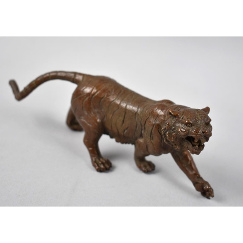 125 - A Patinated Bronze Study of a Tiger, 15cms Long