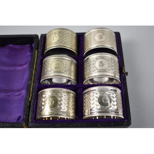 129 - A Cased and Numbered set of Six Silver Plated Napkin Rings together with a Cased Set Comprising Eggc... 