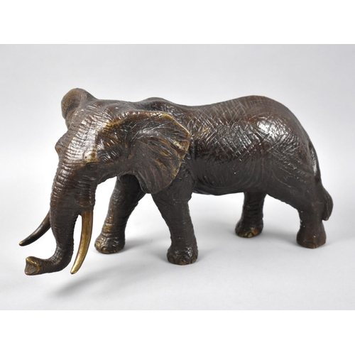 134 - A Large Patinated Bronze Study of a Bull Elephant, 29cms Long