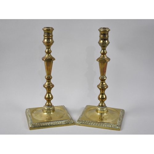 14 - A Pair of 19th Century Brass Candlesticks on Square Bases, 26cms High