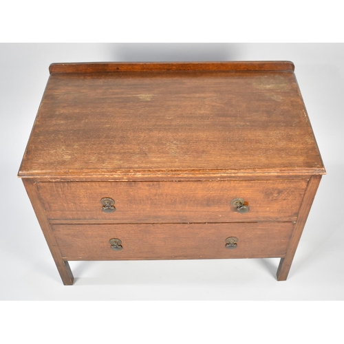 147 - A Mid 20th Century Oak Two Drawer Low Chest, 84cms Wide and 62cms High