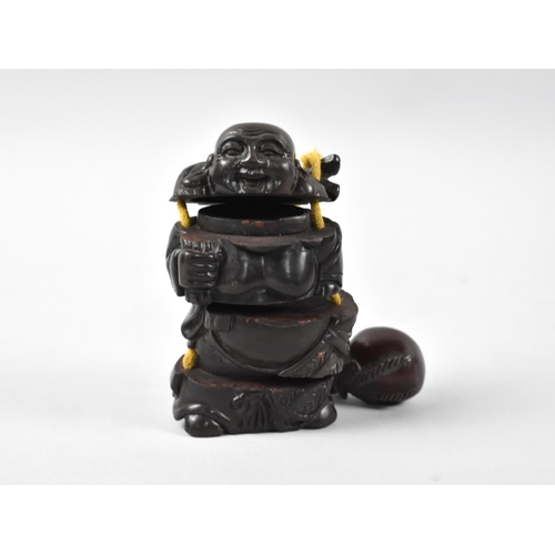 169 - A Reproduction Carved Wooden Inro in the Form of a Smiling Elder with Netsuke in the form of a Sack