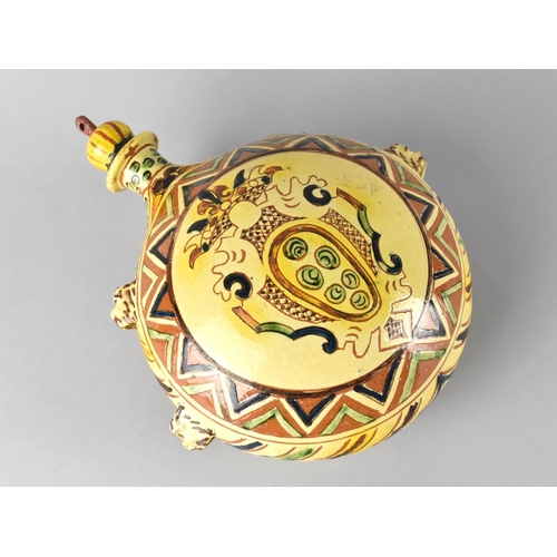 179 - A Continental Faience Circular Moon Flask with Screw Off Stopper, 24cms High