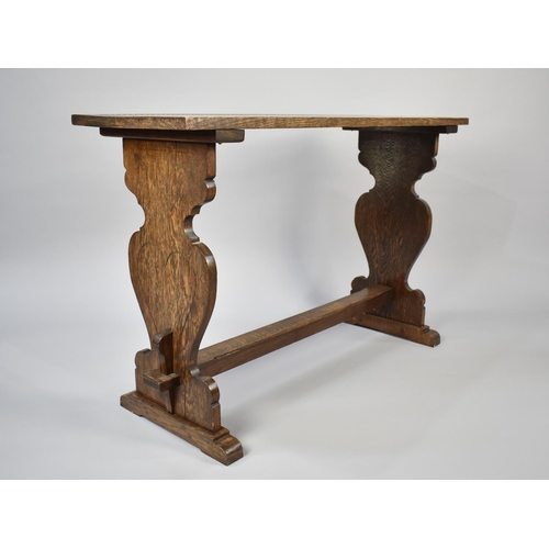 186 - An Oak Refectory Style Side Table with Shaped Supports and Carved Top, 108cms by 37cms