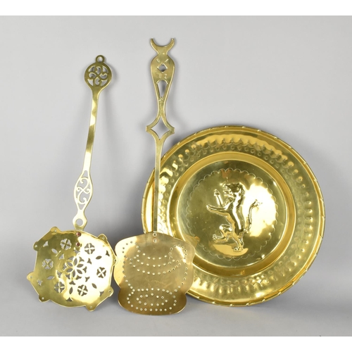 197 - Two Large Brass Skimmers and a Brass Charger with Lion Rampant in relief, 40cm Diameter