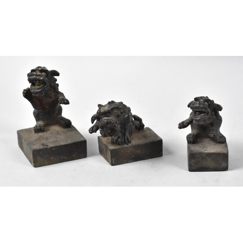 202 - A Collection of Three Chinese Bronze Seals Decorated with Temple Dogs, tallest 7cms High