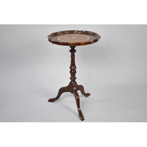 251 - A Reproduction Mahogany Tripod Wine Table with Tooled Leather Disc