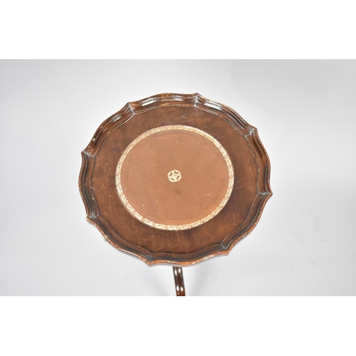 251 - A Reproduction Mahogany Tripod Wine Table with Tooled Leather Disc