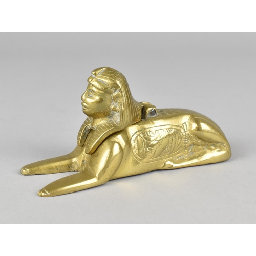 27 - A Late Victorian/Edwardian Brass Egyptian Revival Desktop Inkwell in the the Form of The Sphinx, Mis... 