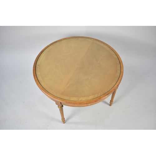 274 - A Modern Walnut Circular Coffee Table with Reeded Supports, 70cms Diameter