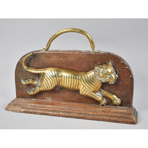 29 - A 19th Century Brass and Wooden Doorstop in the Form of a Galloping Tiger, 32cms Long