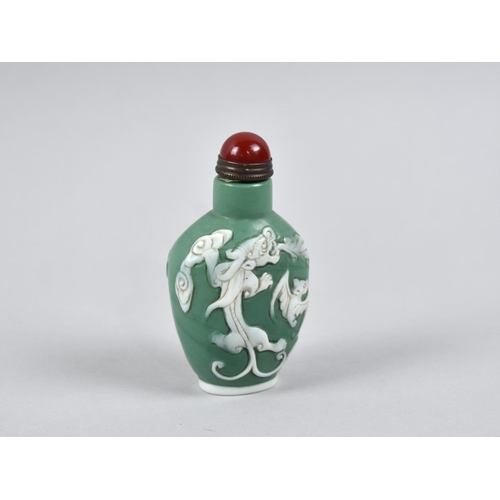 294 - A Reproduction Chinese Overlaid Snuff Bottle Decorated with Dragon and Bat, 8.5cm high