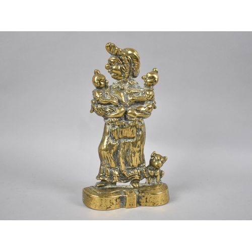 32 - A 19th Century Cast Brass Doorstop in the Form of Judy Holding Twins, 26.5cms High