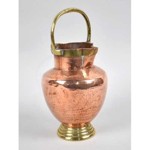 34 - A Vintage Copper and Brass Double Spout Jug with Loop Handle, 21.5cms High