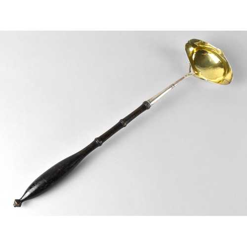 421 - A Silver Ladle with Turned Wooden Handle, 38.5cm long