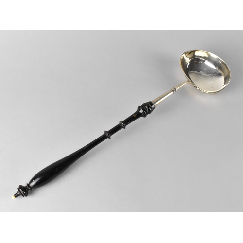 422 - A Silver Ladle with Turned Wooden Handle, Unmarked but Believed to be Silver, 41cm long