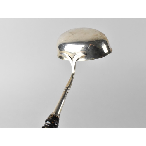 422 - A Silver Ladle with Turned Wooden Handle, Unmarked but Believed to be Silver, 41cm long