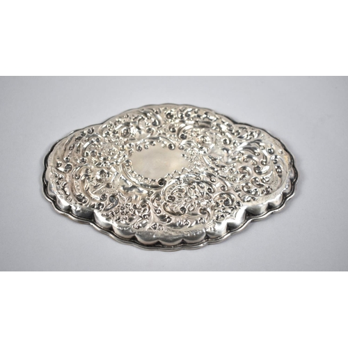 428 - A Silver Dish with Ornate Repousse Decoration, 17.5cm wide