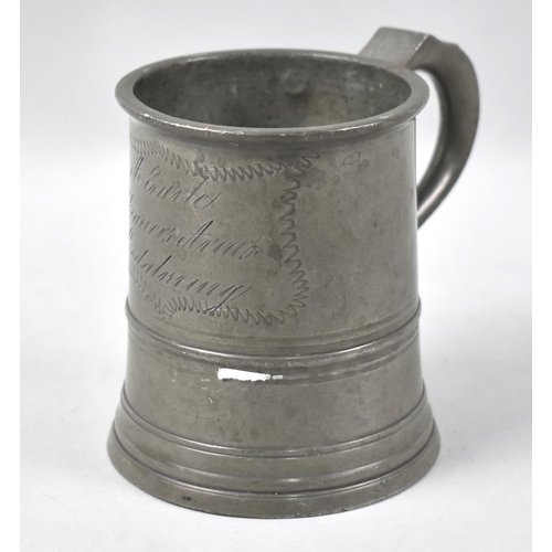 43 - A 19th Century Pewter One Pint Tankard inscribed  for A Earle, Skinners Arms, Godalming