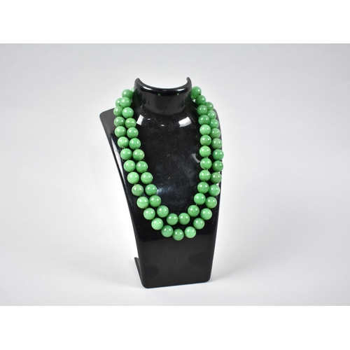 461 - A String of Green Jade Effect Stone Beads, 84cms Long