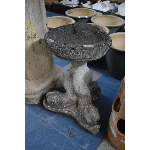 471 - A Reconstituted Stone Bird Bath having Dolphin Supports, 30cms Wide and 46cms High