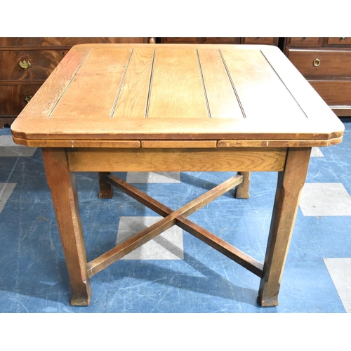 535 - An Edwardian Oak Draw Leaf Dining Table, Extends to 152cms by 91cms