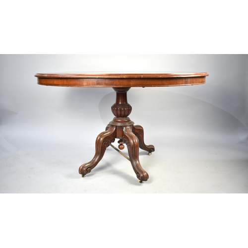 537 - A Late 19th Century Mahogany Oval Snap Top Occasional Table, 122cms by 86cms, Scrolled Feet