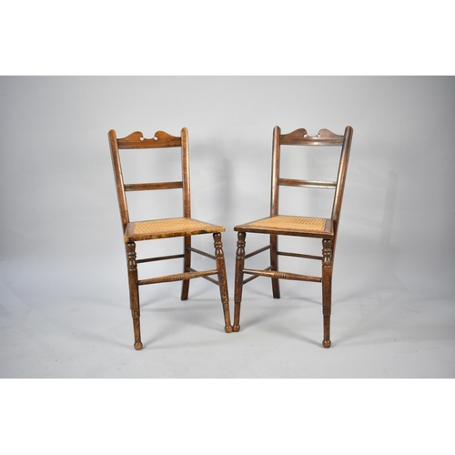 554 - A Pair of Early 20th Century Cane Seated Chairs