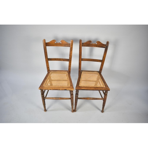 554 - A Pair of Early 20th Century Cane Seated Chairs