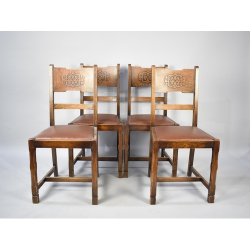 555 - A Set of Four Dining Chairs