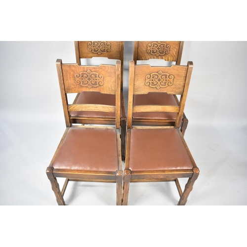 555 - A Set of Four Dining Chairs