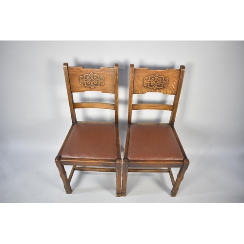 555 - A Set of Four Dining Chairs