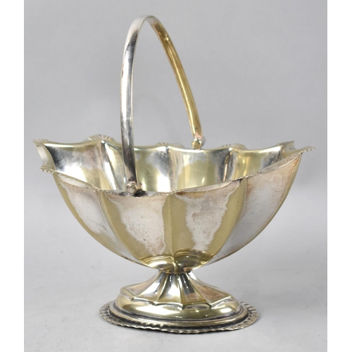 66 - An Edwardian Silver Plated Basket Shaped Sweetmeat Dish with Hinged Handle, 15cms Wide