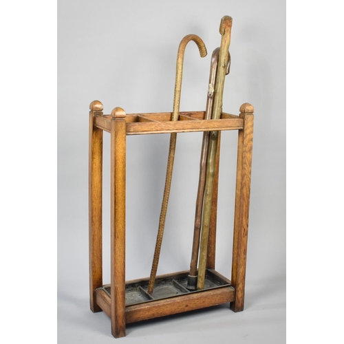 72 - An Edwardian Oak Three Section Stick Stand with Metal Drip Tray and Complete with Three Vintage Rust... 