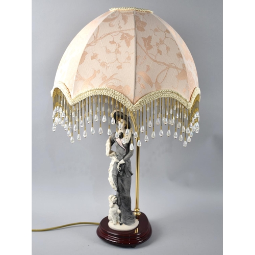 76 - An Italian Figural Table Lamp complete with Shade, 60cms High