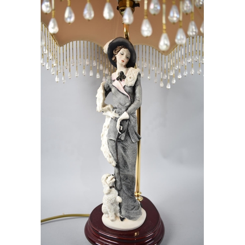 76 - An Italian Figural Table Lamp complete with Shade, 60cms High